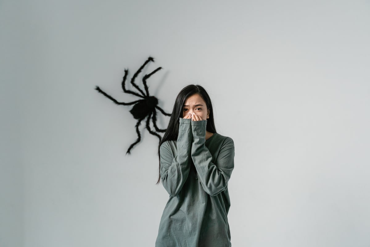 A Fearful Woman Having Arachnophobia