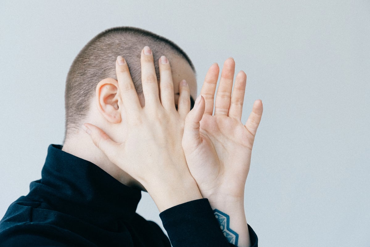 Woman Covering Her Face